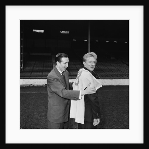 Manchester City new signing Denis Law with Ken Barnes trying his new shirt for size by Thomas