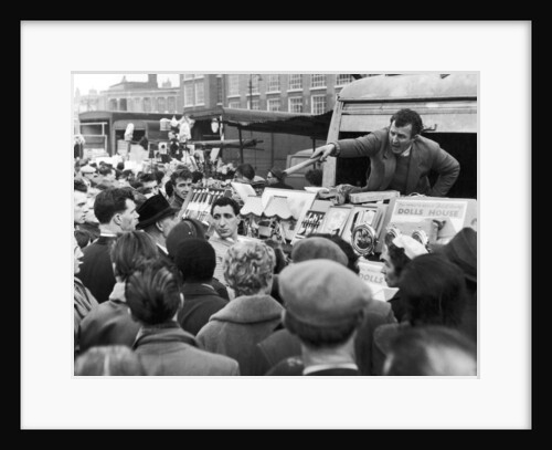 A stall holder at Petticoat Lane market by Anonymous