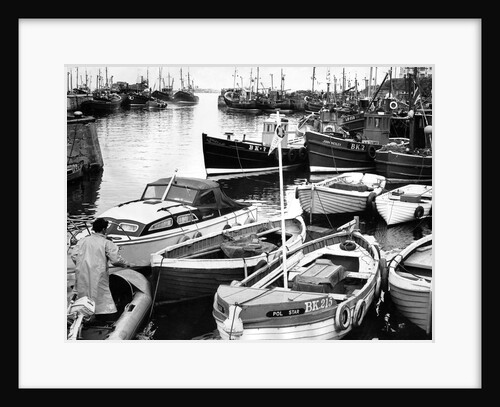 The crowded harbour at the coastal village of Seahouses by NCJ
