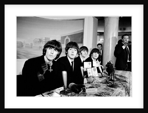 The Beatles pose with their MBEs by Gavin