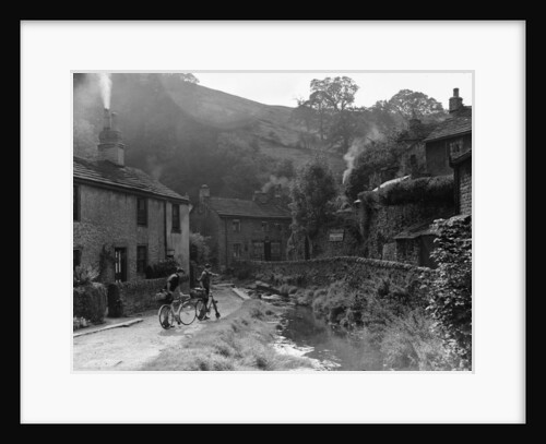 Two boys out on their bicycles near a stream in the Peak District village of Castletown by Anonymous