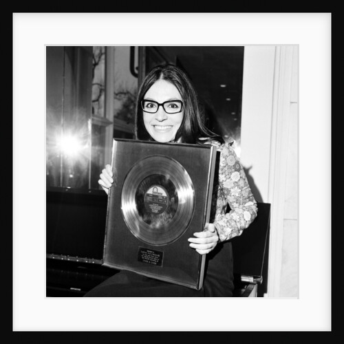 Nana Mouskouri presented with a gold disc by Maurice Kaye