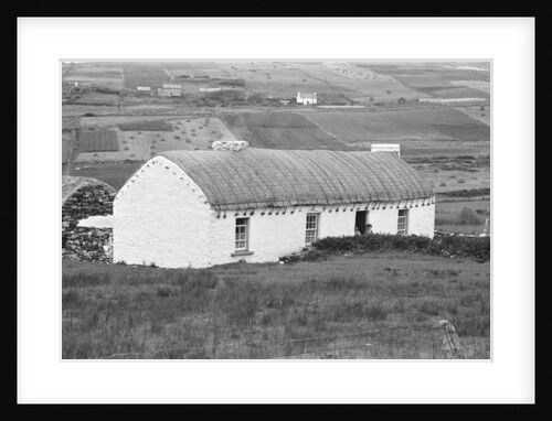 A traditional farmhouse with a thatched roof by Staff