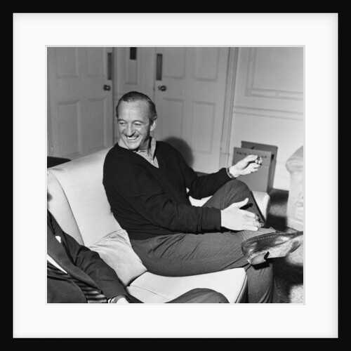 David Niven relaxing in his London hotel suite by Malcolm MacNeil