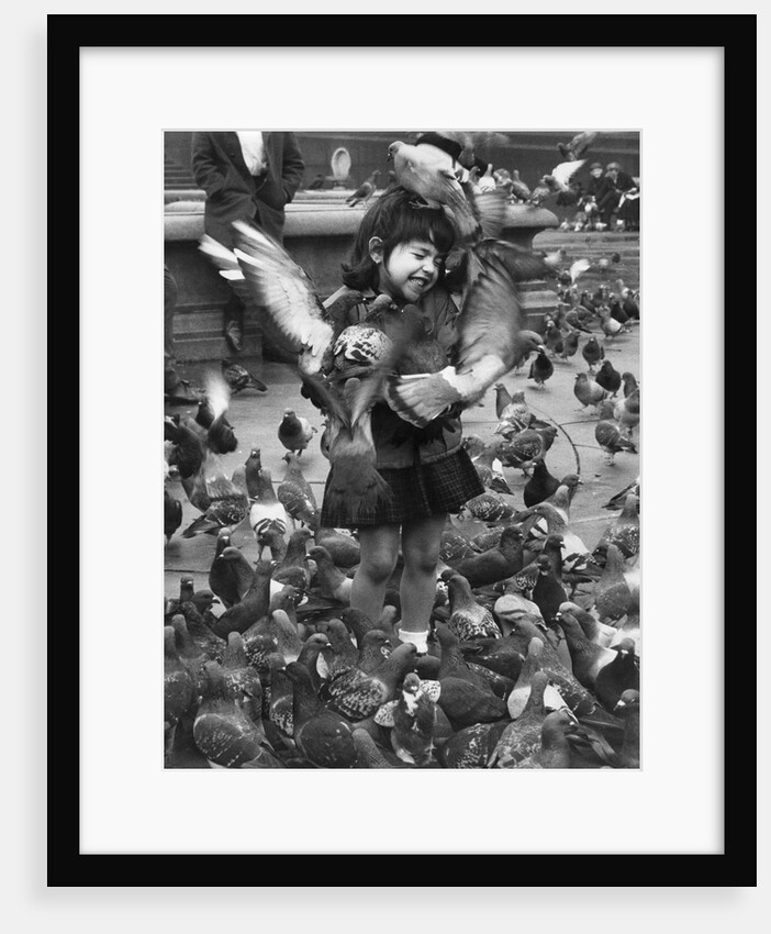 Young girl surrounded by hungry pigeons by Anonymous
