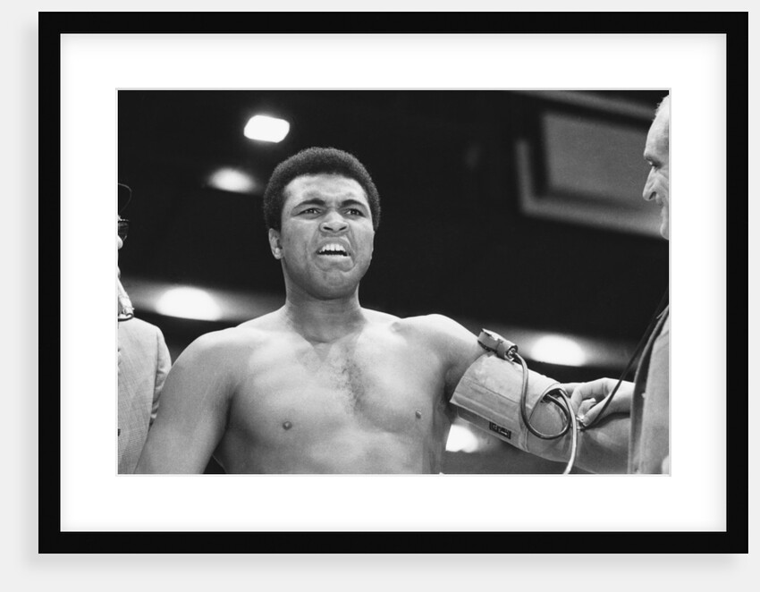 Muhammad Ali having his blood pressure taken by Monre Fresco