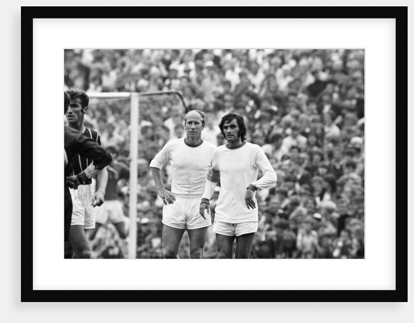 Bobby Charlton and George Best await a free kick 1969 by Monte Fresco