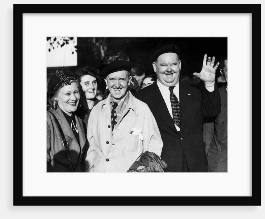 Stan laurel and Oliver hardy outside Coventry station August 1947. by Staff