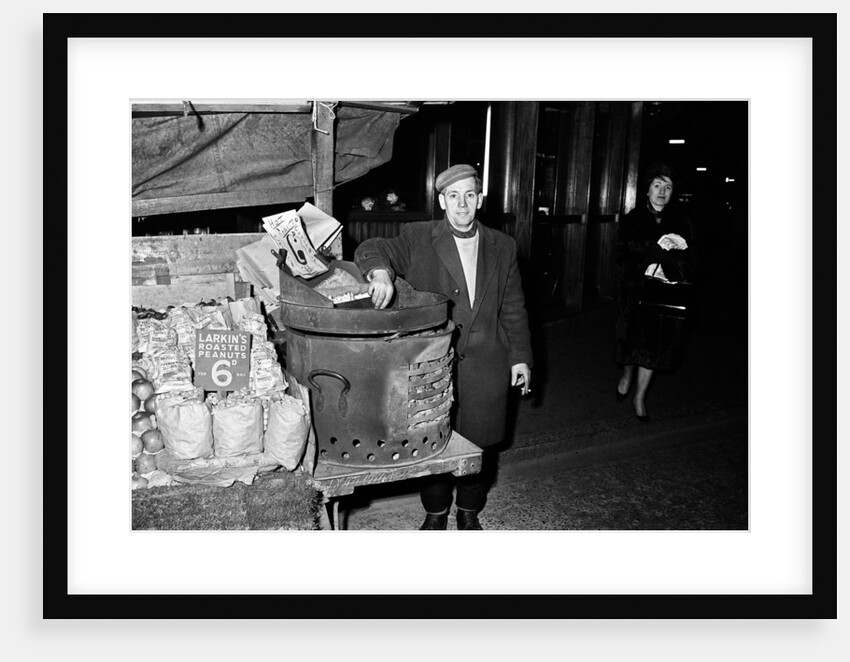 Hot Chestnut hawker in Leicester Square, London. 9th October 1963. by Tanner