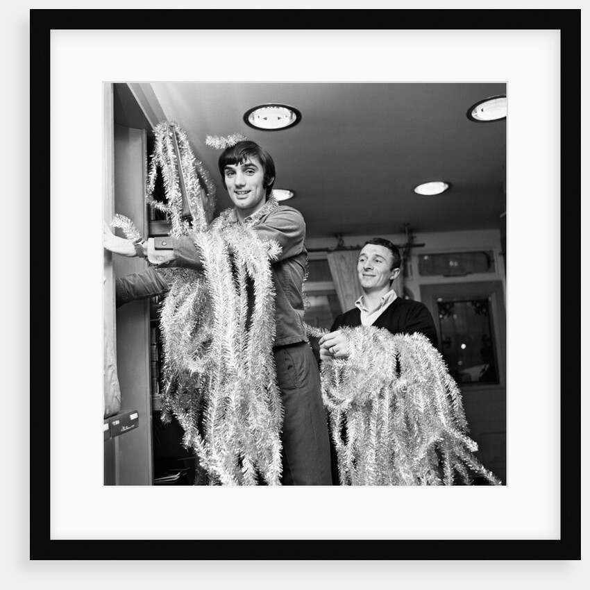 George Best decorating his Edwardian boutique 1967 by Staff