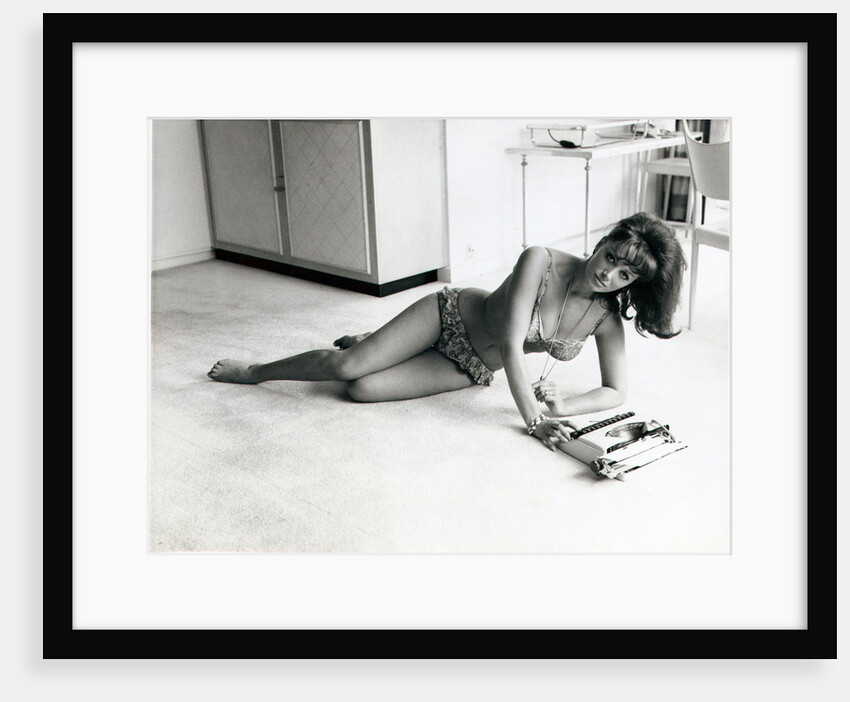 Jackie Collins, author and actress, and sister to Joan Collins, pictured in her Hampstead, London, flat on 6th August 1964 by Daily Mirror