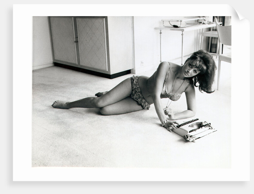 Jackie Collins, author and actress, and sister to Joan Collins, pictured in her Hampstead, London, flat on 6th August 1964 by Daily Mirror