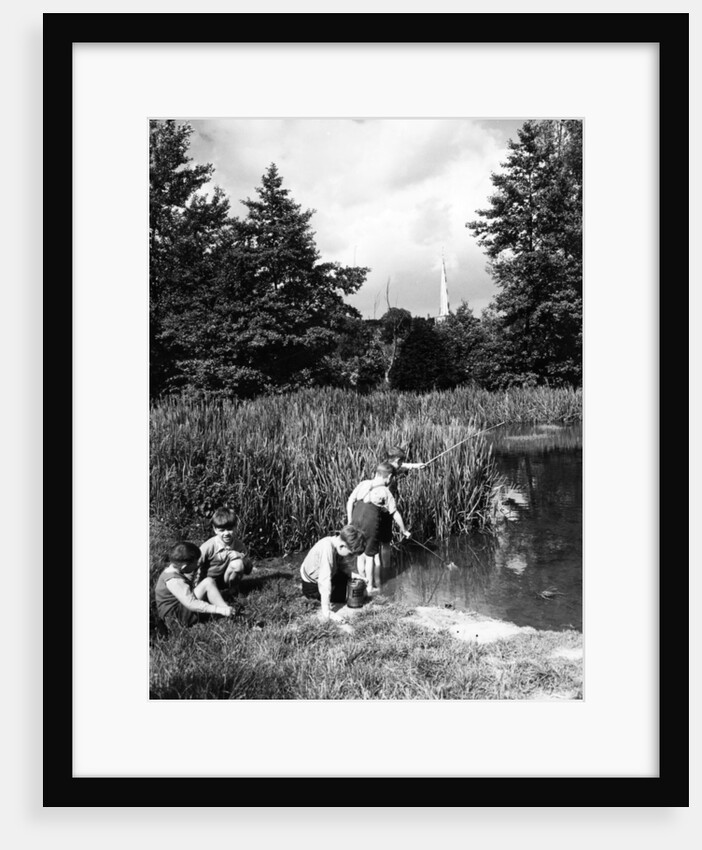 Boys fishing in the river circa 1939 by Staff