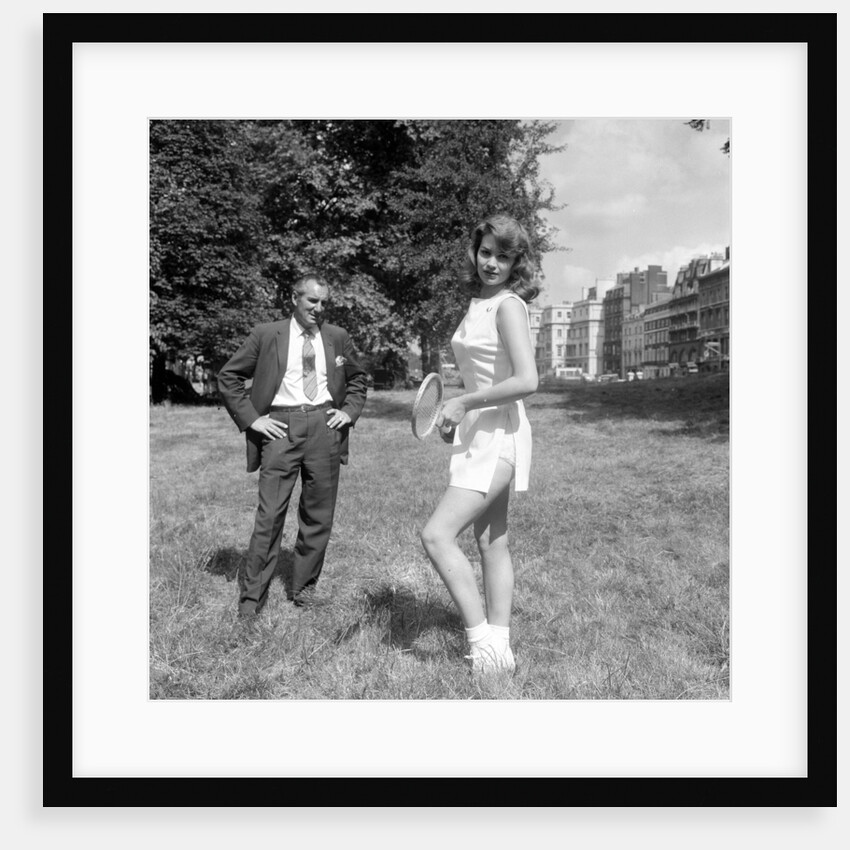 Fred Perry with actress Yvonne Buckingham, during a coaching session. by Staff