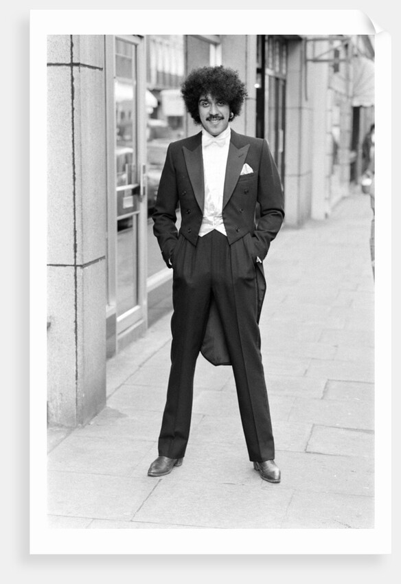 Phil Lynott in London, modelling clothes from Saville Row. 1983 by Mike Maloney