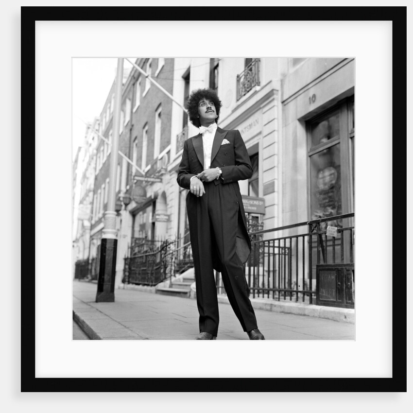 Phil Lynott in London, modelling clothes from Saville Row. 1983 by Mike Maloney