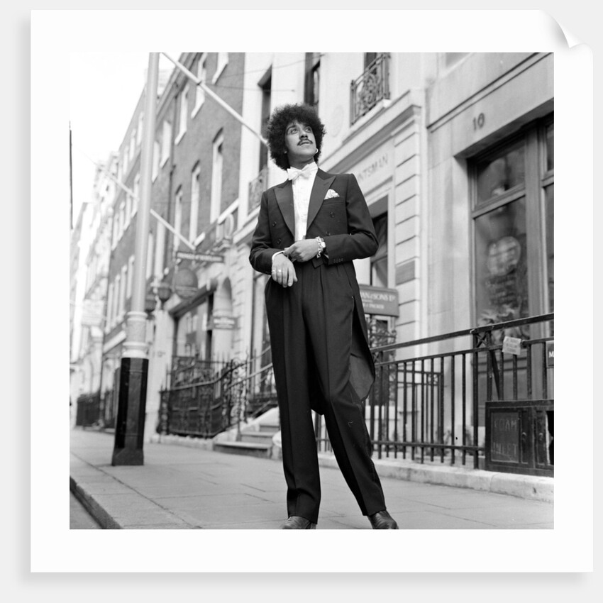 Phil Lynott in London, modelling clothes from Saville Row. 1983 by Mike Maloney