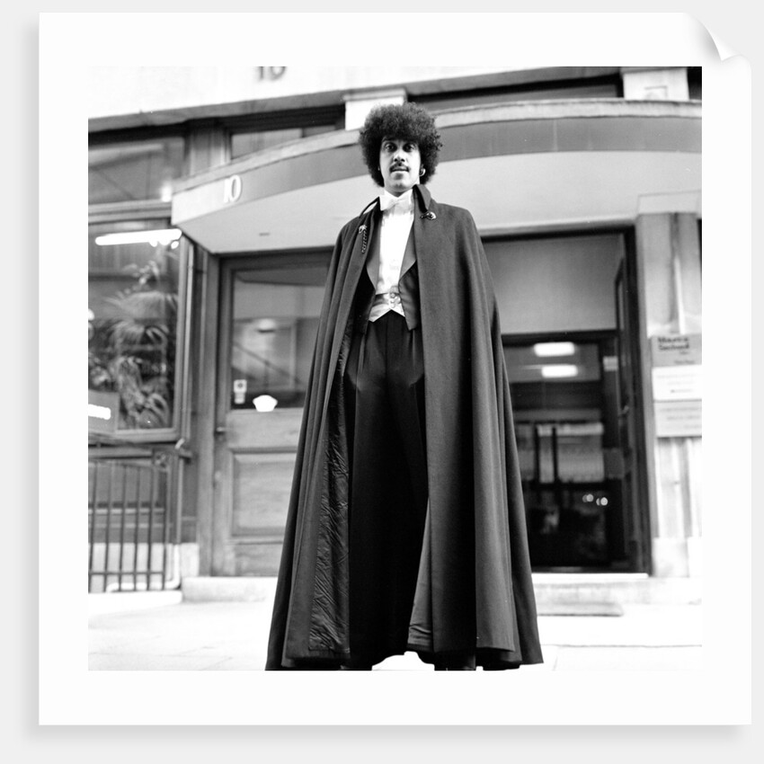 Phil Lynott in London, modelling clothes from Saville Row. 1983 by Mike Maloney