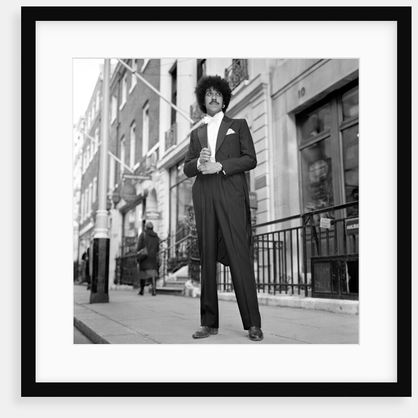 Phil Lynott in London, modelling clothes from Saville Row. 1983 by Mike Maloney