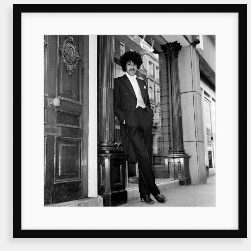 Phil Lynott in London, modelling clothes from Saville Row. 1983 by Mike Maloney
