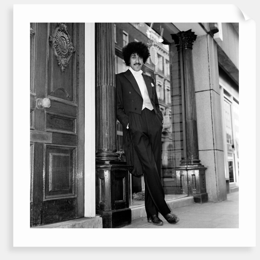 Phil Lynott in London, modelling clothes from Saville Row. 1983 by Mike Maloney