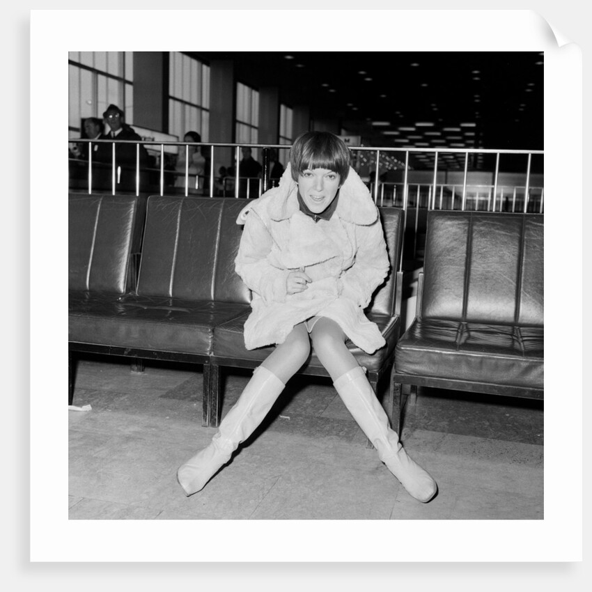 Mary Quant, at London Airport, on her way to Paris to go to a fancy dress ball. by Staff
