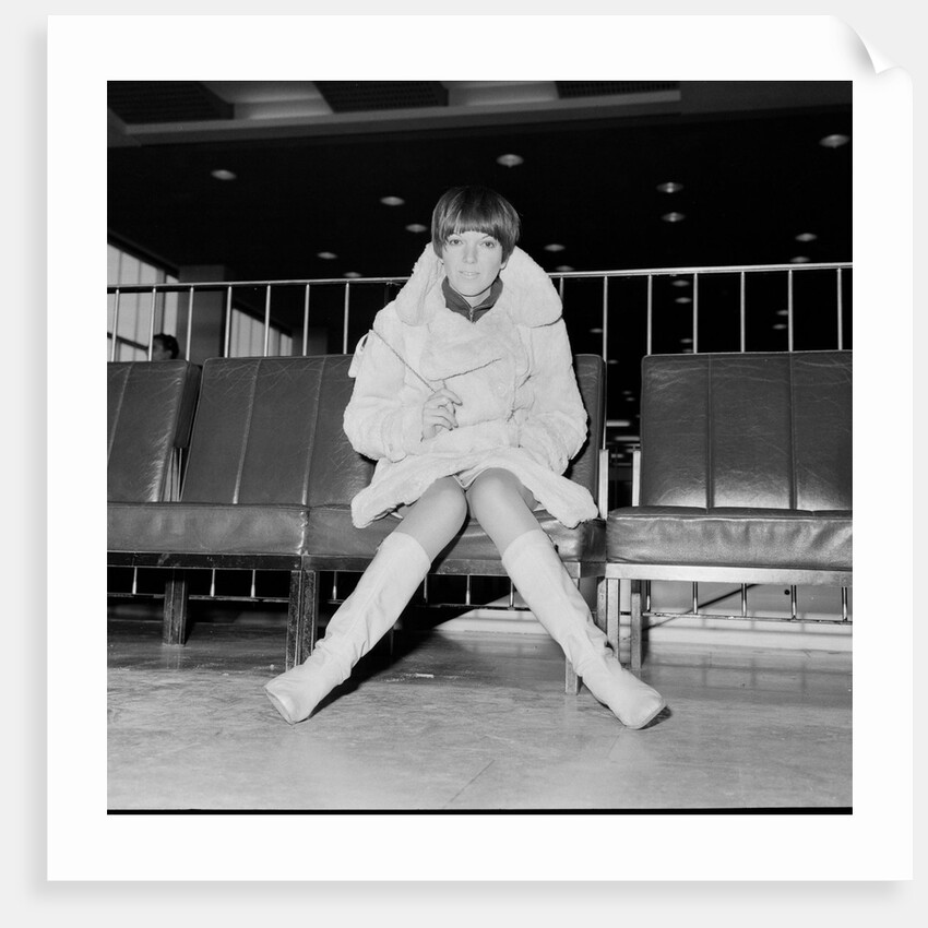 Mary Quant, at London Airport, on her way to Paris to go to a fancy dress ball. by Staff