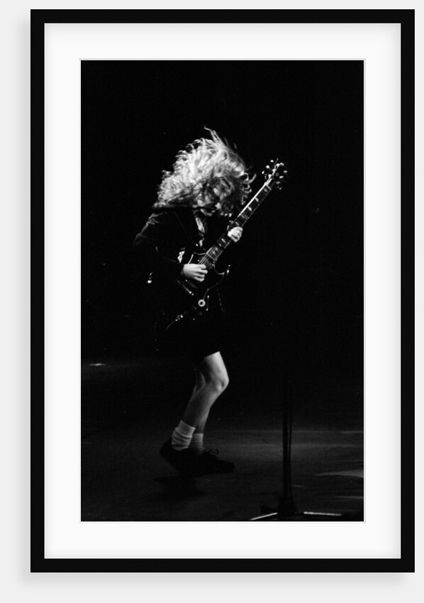 Angus Young from the group ACDC by Staff