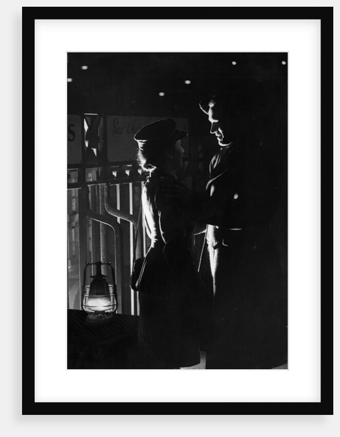 A young wartime couple say their goodbyes at the station as he returns to his army unit. 20th February 1944 by Staff