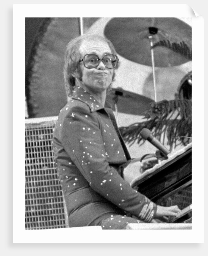 Elton John performing on stage at Wembley Stadium., London, England in June 1975 by Chris Barham