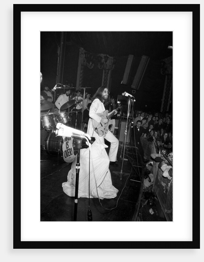 John Lennon and Yoko Ono on stage at the Lyceum. by Ray Weaver