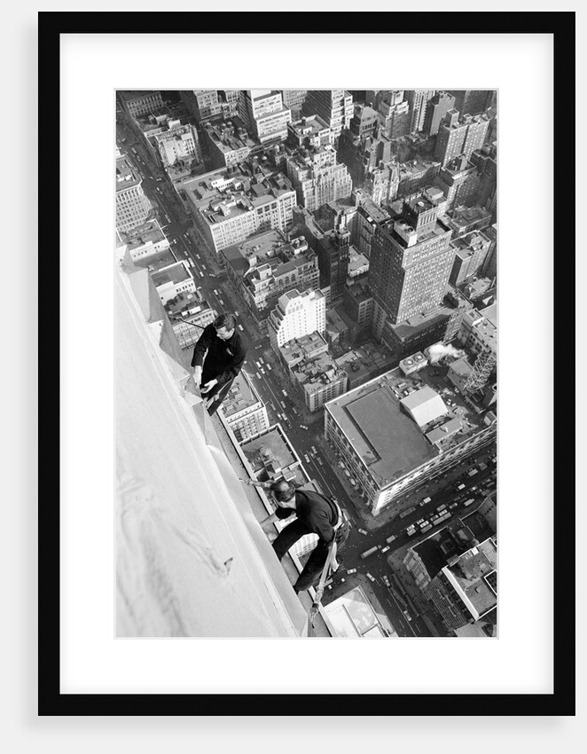 Workmen busy cleaning windows 1000 ft up the Empire State building by Daily Herald