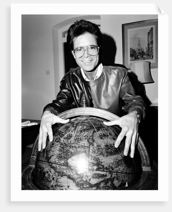Cliff Richard with a globe by Anonymous