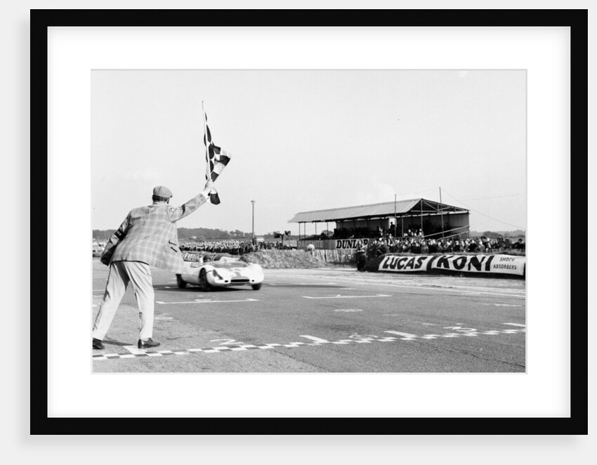 Jim Clark takes the checkered flag by Staff
