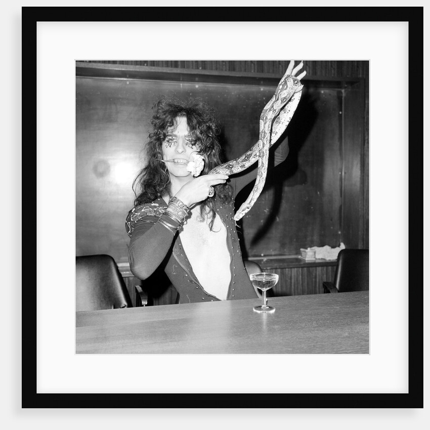 Alice Cooper with his pet boa constrictor by Anonymous