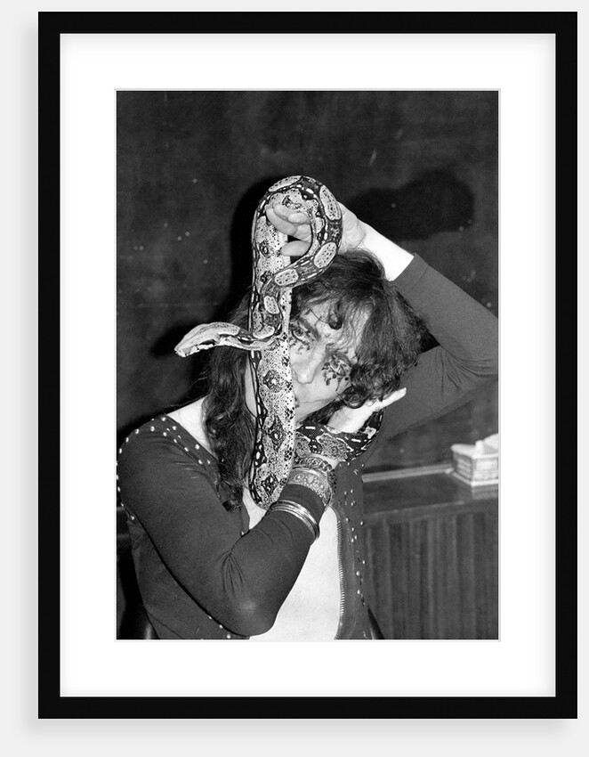 Alice Cooper with his pet boa constrictor by Anonymous
