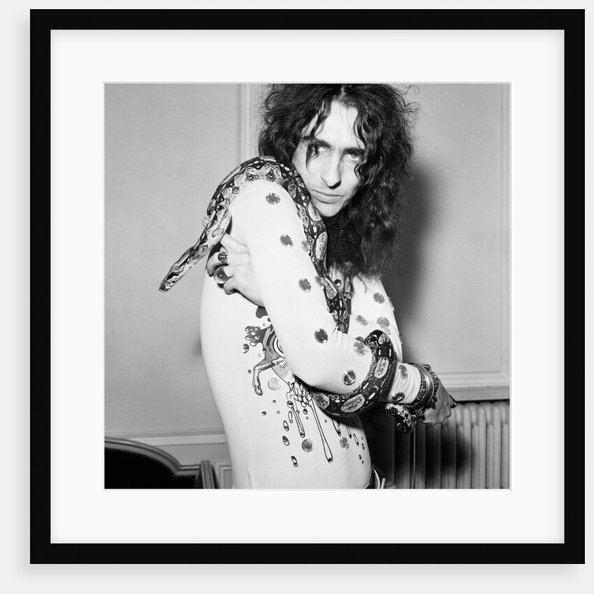 Alice Cooper poses with his snake by Peter Stone