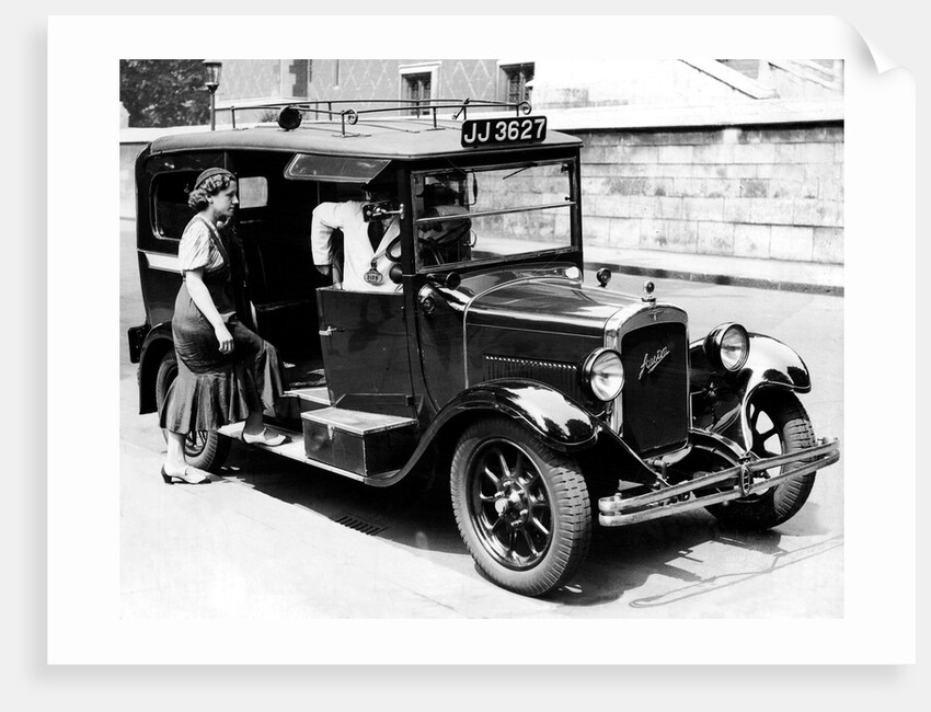 A female passenger entering one of the new London taxi cabs by Staff