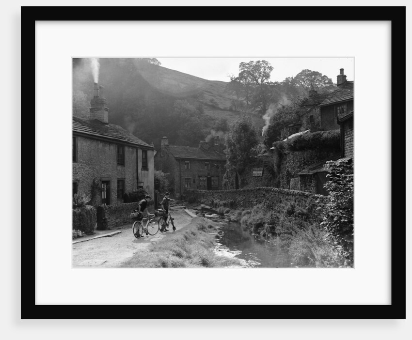 Two boys out on their bicycles near a stream in the Peak District village of Castletown by Anonymous