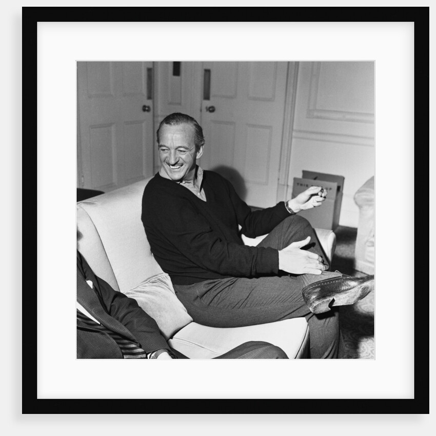 David Niven relaxing in his London hotel suite by Malcolm MacNeil