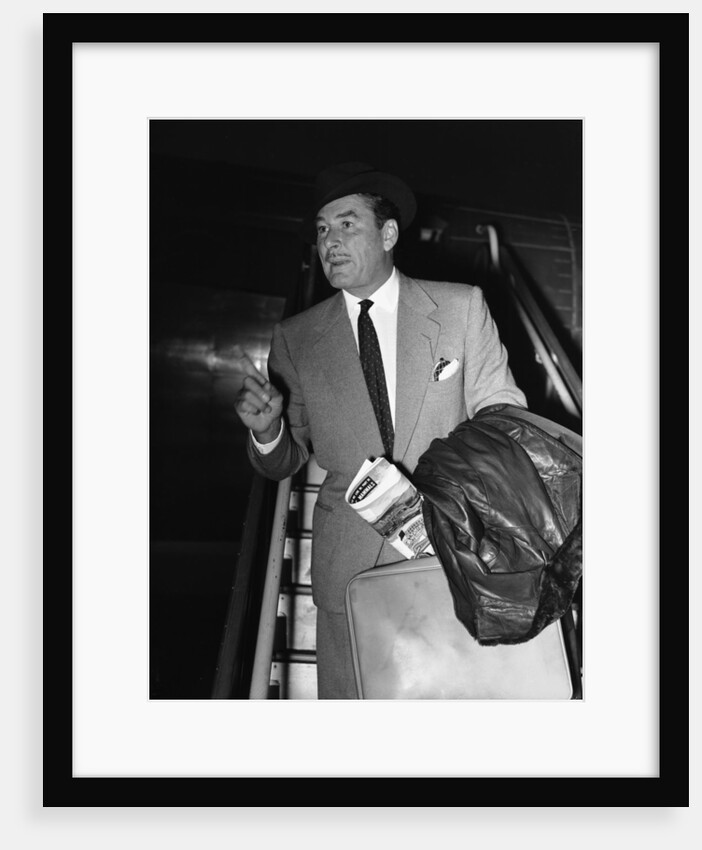 Errol Flynn arriving at London Airport 17th November 1953 by Anonymous