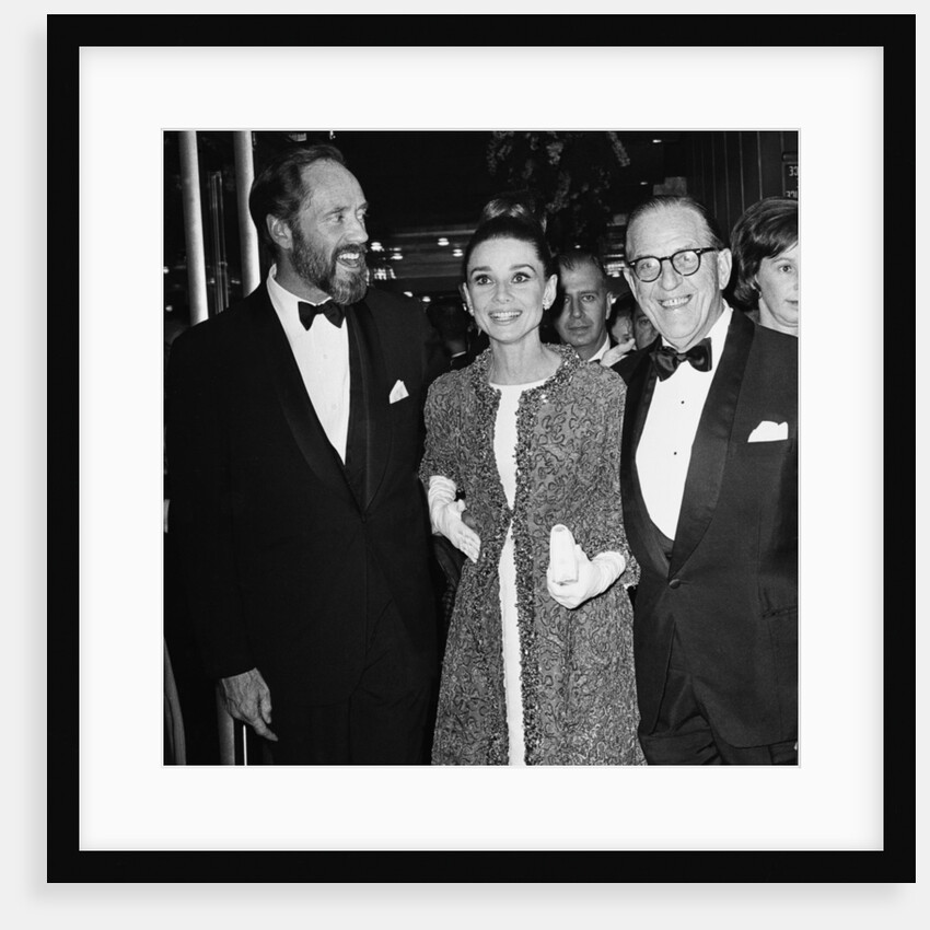 Audrey Hepburn arrives for the premiere of My Fair Lady in New York with husband Mel Ferrer and Stan Holloway by Anonymous