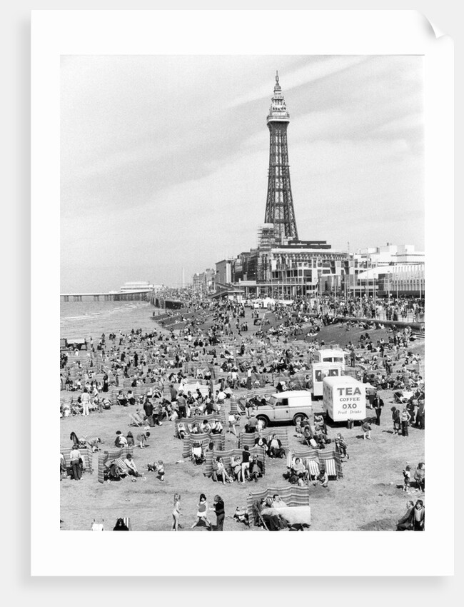 Blackpool Tower with people sitting on Blackpool Beach by Anonymous