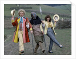 Colin Baker with Nicola Bryant who plays Perpugilliam "Peri" Brown during filming at Butser Ancient Farm Project, Butser Hill, Hampshire for the story The Mysterious Planet, part of the larger Trial of A Time Lord narrative. 10th April 1986. by Anonymous