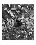 Young girl surrounded by hungry pigeons by Anonymous