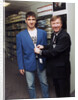 Alex Ferguson with Eric Cantona in a clothes shop by Holland