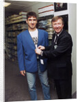 Alex Ferguson with Eric Cantona in a clothes shop by Holland