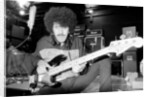 Phil Lynott of Thin Lizzy during a recording session for the groups new album. by Andy Hosie