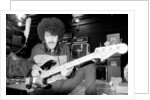 Phil Lynott of Thin Lizzy during a recording session for the groups new album. by Andy Hosie