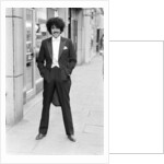 Phil Lynott in London, modelling clothes from Saville Row. 1983 by Mike Maloney